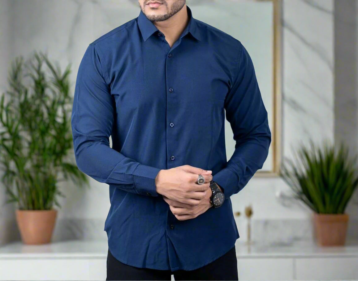 Man wearing a blue dress shirt on a white background