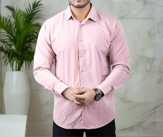 Person wearing a light pink dress shirt on a white background